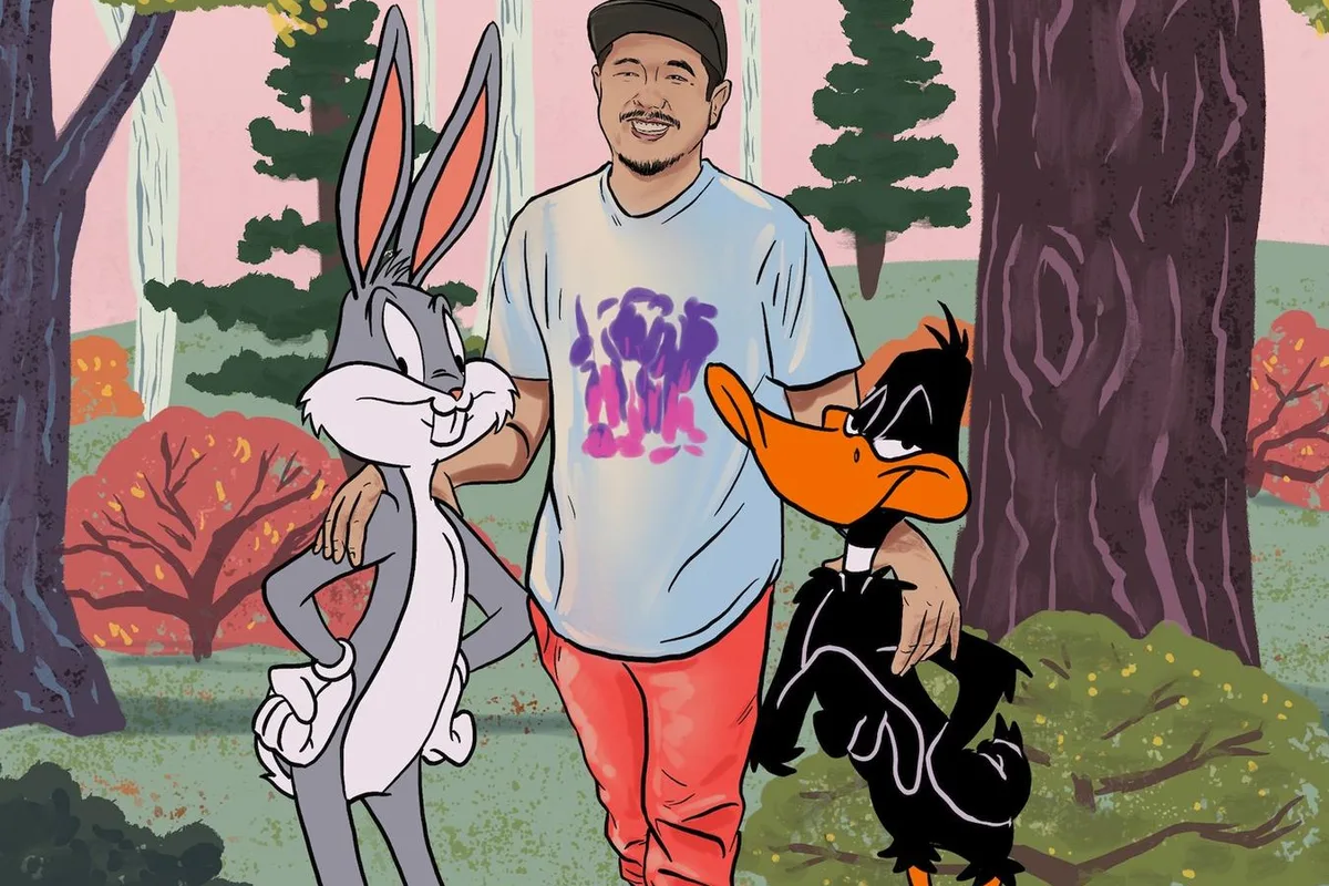 Illustration éditoriale montrant Eric Bauza aux côtés de Bugs Bunny et Daffy Duck